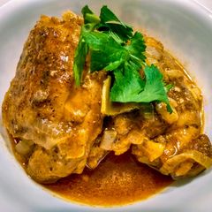 A picture of Chicken Braised in Coconut and Tomato.