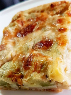 Una foto de Pastel de ajoporro, jamón y calabacín