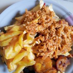 A picture of Irish/plantain with egg sauce.