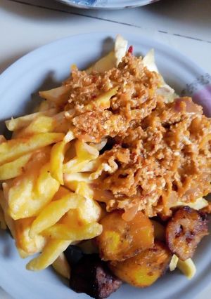 A picture of Irish/plantain with egg sauce.