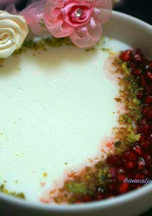 A picture of Malabi with pomegranate syrup.
