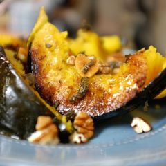 A picture of Cumin Rubbed Roasted Acorn Squash with Sage Garlic Butter.