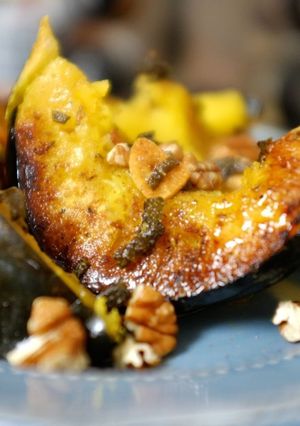 A picture of Cumin Rubbed Roasted Acorn Squash with Sage Garlic Butter.