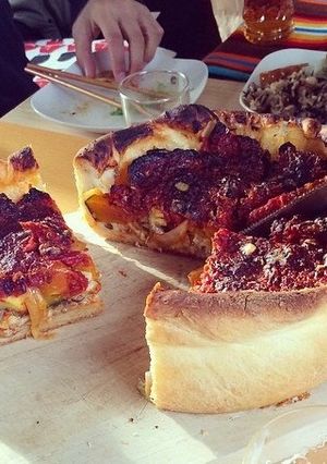 A picture of Chicago-style Deep Dish Pizza .