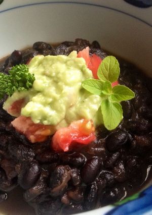 A picture of Black Bean Soup with Creamy Avocado.