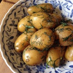 A picture of Steamed Potatoes with Dill Butter.