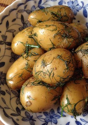 A picture of Steamed Potatoes with Dill Butter.