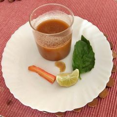 A picture of Detox water shot made with basil leaves.