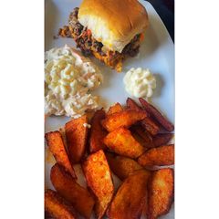 A picture of Cheeseburger sliders with paprika wedges.
