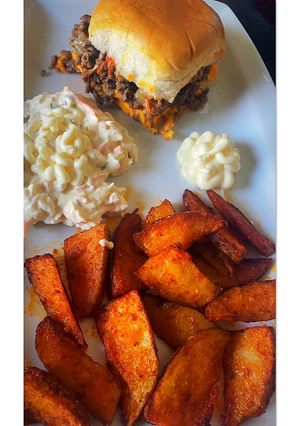 A picture of Cheeseburger sliders with paprika wedges.