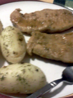 A picture of sweet n sour pork chops with parsley potatoes.