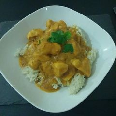 A picture of Satay Curry and coconut rice.