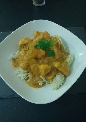 A picture of Satay Curry and coconut rice.