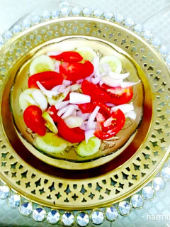 A picture of Tomato Onion Cucumber Salad.