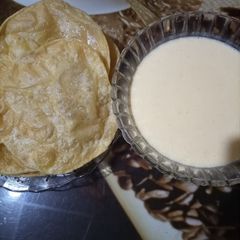 A picture of Aamrus & poori.