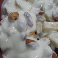 A picture of Chopped Apple with cashew nuts, Almond nuts and yoghurt.