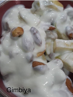 A picture of Chopped Apple with cashew nuts, Almond nuts and yoghurt.