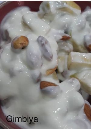 A picture of Chopped Apple with cashew nuts, Almond nuts and yoghurt.