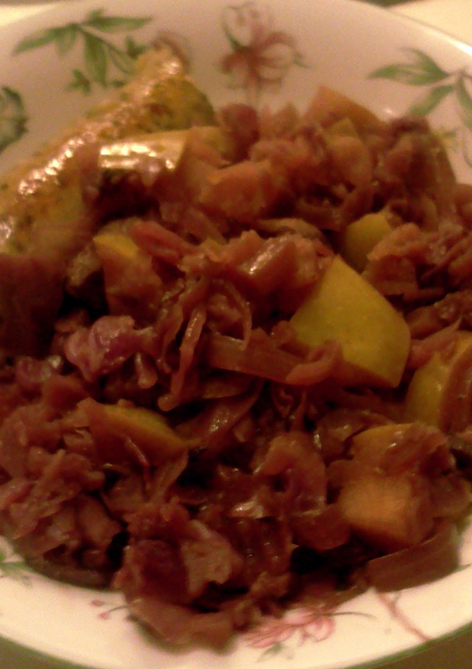 A picture of red cabbage with apples & wine.
