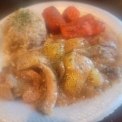A picture of Mein Hasenpfeffer -rabbit w/onion,potatoes, mushrooms,wine gravy.