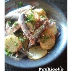 A picture of Pan-fried Potatoes and Sardines with Garlic and Cheese .