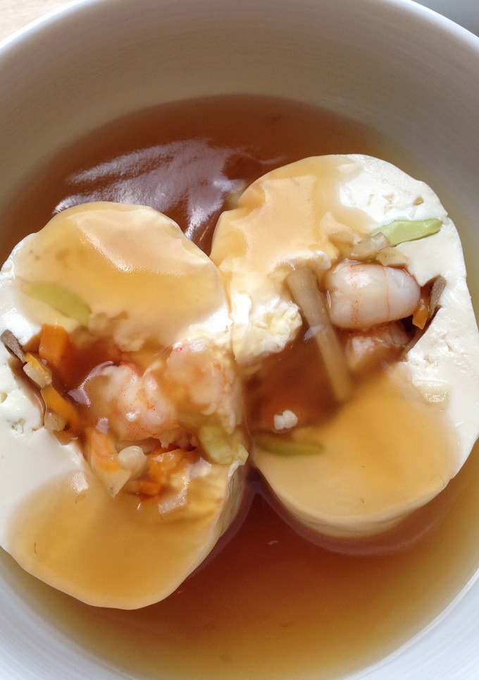 A picture of Rolled Tofu with Broth.