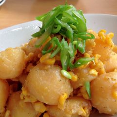 A picture of Potatoes & Corn with Butter & Soy Sauce.
