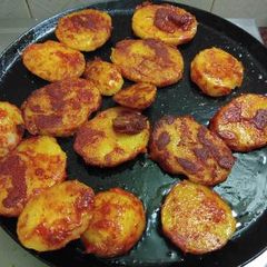 Title:Fried potatoes on tawa A picture of Title:Fried potatoes on tawa.