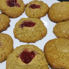 A picture of Easy oat cookies with raspberry jam and peanut butter filling.