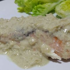 A picture of Baked salmon in blue cheese creamy paradise.