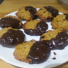 A picture of Ginger oat biscuits with dark chocolate.