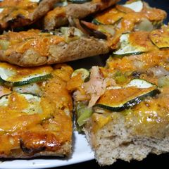 A picture of Whole-wheat Pizza with Smoked Salmon, Courgette and Chillies.