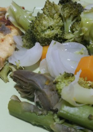 A picture of Grilled chicken breast with steamed vegetables.