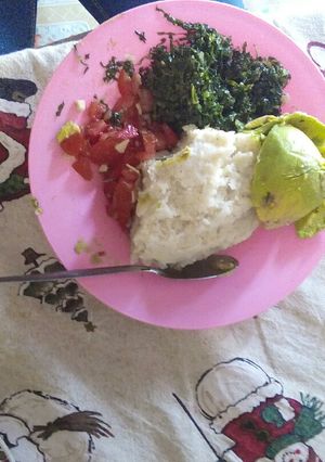 A picture of Fried kales,ugali plus kachumbari.