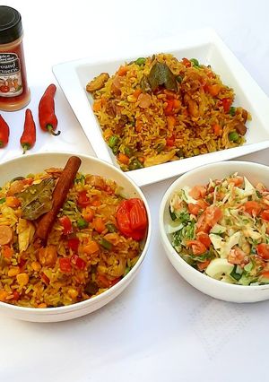 A picture of Sausage and shredded chicken fried rice.