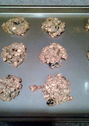 A picture of Oatmeal Cookies with dried cherrie and dried blueberries.