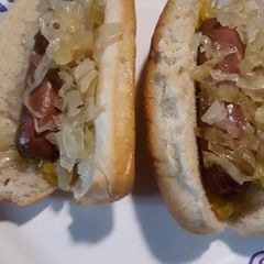A picture of Homemade Fermented Sauerkraut on Hotdogs.