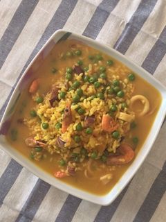 Una foto de Arroz caldoso de pescado con truco