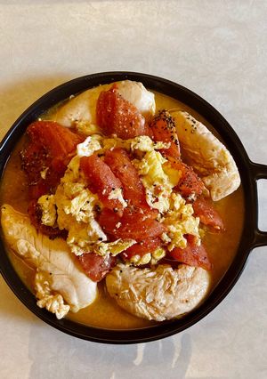 A picture of Chicken Tenderloin with Tomato and Scrambled Eggs.