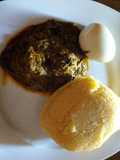 Banga soup with boiled egg and Eba