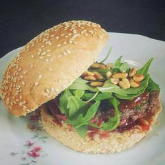 A picture of Feta cheese Burger with Roasted figs.