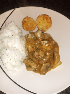 A picture of coconut chicken & mushroom with sweet dumplings & rice.