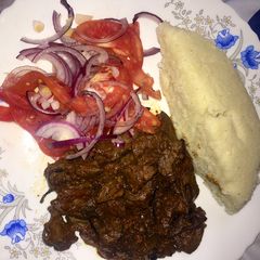 A picture of Ugali, liver and Kachumbari.