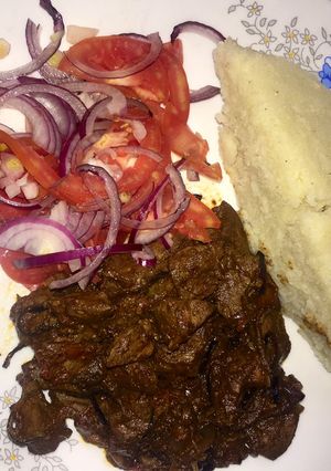 A picture of Ugali, liver and Kachumbari.