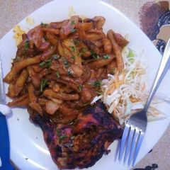 A picture of Marinated grilled chicken and chips masala.