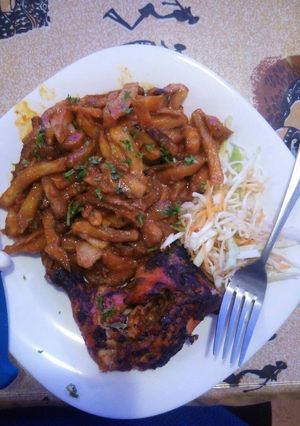 A picture of Marinated grilled chicken and chips masala.