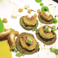 A picture of Palak bytes with cheese falafal.