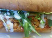 A picture of arugula chicken sandwich