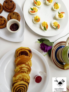 A picture of Devilled eggs, Japanese Pancakes, Smiley potato Pakora.