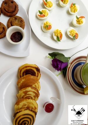 A picture of Devilled eggs, Japanese Pancakes, Smiley potato Pakora.